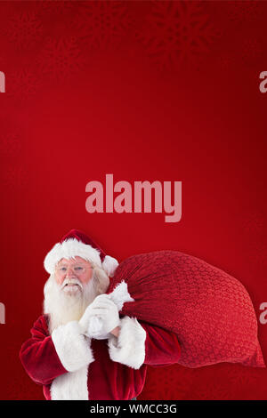 Composite image of santa claus carrying sack against red background Stock Photo