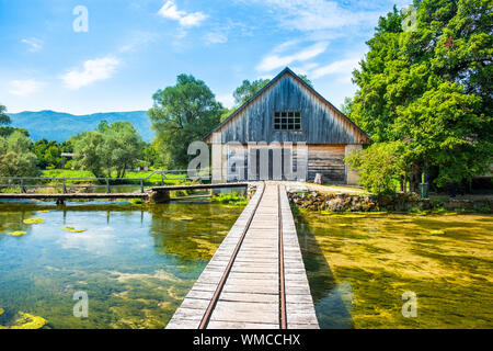 Croatia, region of Lika, Majerovo vrilo river source of Gacka, traditional village, old wooden mills and cottages Stock Photo