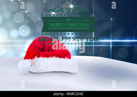 Merry christmas message against light design on blue background Stock Photo