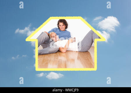 Composite image of young couple sitting together against cloudy sky Stock Photo