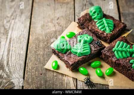 Halloween style party sweet - brownie with green skeleton and bones Stock Photo