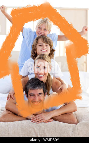 Loving family having fun against house outline in clouds Stock Photo
