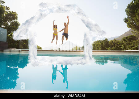 Cheerful couple jumping into swimming pool against house outline in clouds Stock Photo