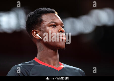 05 September 2019, China, Shenzhen: Basketball: WM, Germany - Jordan, preliminary round, group G, 3rd matchday at Shenzhen Bay Sports Center. Germany's Dennis Schröder stands with earphones warming up in the hall. Photo: Swen Pförtner/dpa Stock Photo