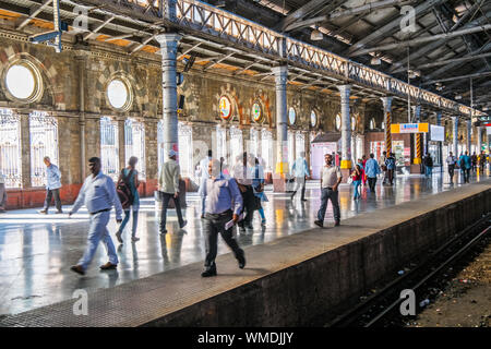 Commuters on the platform at  the Chhatrapati Shivaji Terminus, CST, railway station, Mumbai,India Stock Photo