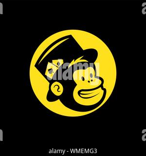 vector head of a magician monkey inside a yellow circle, in black baground Stock Vector