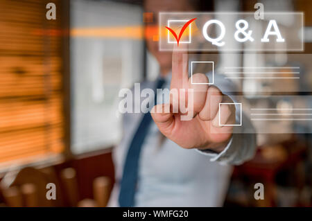 Word writing text Q And A Question. Business photo showcasing in which demonstrating asks questions and another one answers them Woman standing Lookin Stock Photo