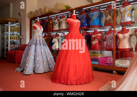 Fancy formal dressing ball gowns for sale at a local shop in Siem