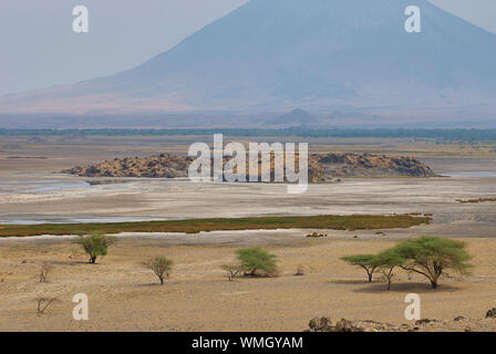 Dried up Lake Natron with the volcano Oldoinyo Lengai in the background Stock Photo