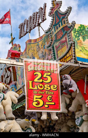 Banner with price information on a lottery booth at a fair. Stock Photo