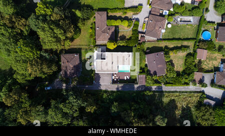 Exterior modern white villa with pool and garden, nobody inside. Aerial view from above Stock Photo