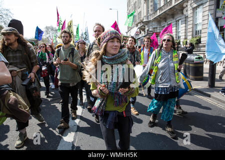 Extinction Rebellion protesters gather in Hyde Park Corner continuing the climate protest through Marble Arch congregating in Piccadilly Circus, UK Stock Photo