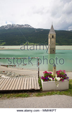 A shot of Lake Reschen in South Tyrol famous for the church belltower which is now all that can be seen of the town that once existed there Stock Photo