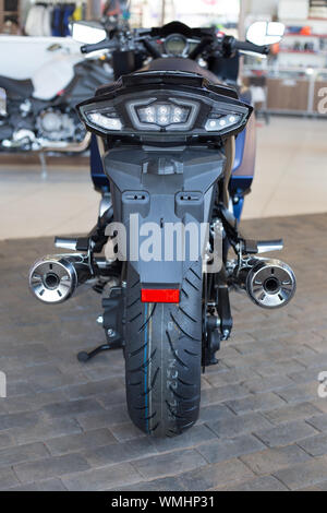 Russia, Izhevsk - August 23, 2019: Yamaha motorcycle shop. New modern motorbike FJR1300 in motorcycle store. Back view. Famous world brand. Stock Photo