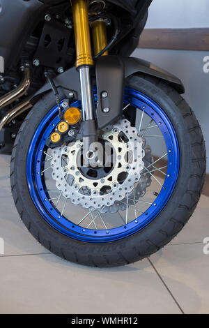 Russia, Izhevsk - August 23, 2019: Yamaha motorcycle shop. Front air fork and motorcycle wheel of the new XT1200. Famous world brand. Stock Photo