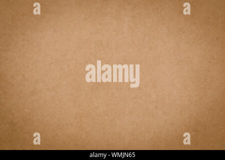 Brown parchment surface, papyrus. Vintage paper sheet texture. Yellow packaging background, dirty card, pattern. Old paper backdrop. Stock Photo