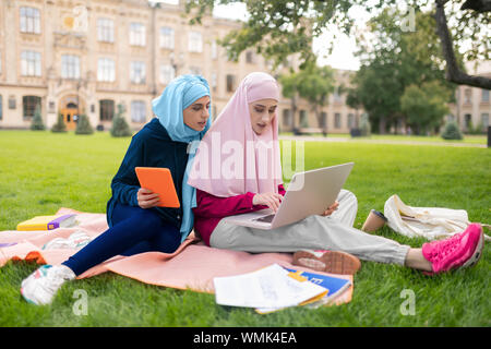 Busy students feeling overloaded having too much homework Stock Photo