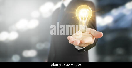 Hand of holding illuminated light bulb, idea, innovation inspiration concept Stock Photo