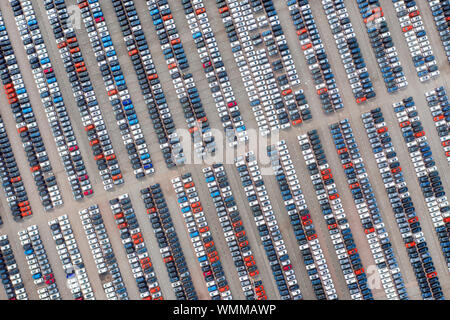 Large parking with many new cars. Aerial top view
