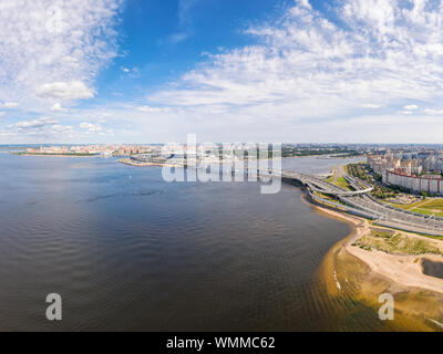 18 AUGUST 2019, Saint Petersburg, Russia. Large panoramic aerial seascape. Estuary of Neva river, elevated highway road, bridge and Krestovskiy stadiu Stock Photo