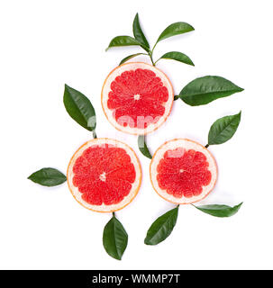 Citrus fruits isolated on white background. Pieces of pink grapefruit isolated on white background, with clipping path. Top view. Stock Photo