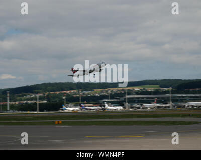 Swiss airplane landing/starting at zurich airport Stock Photo