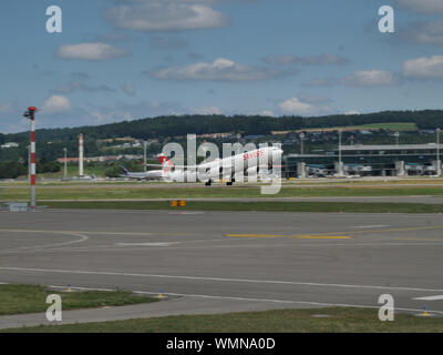 Swiss airplane landing/starting at zurich airport Stock Photo