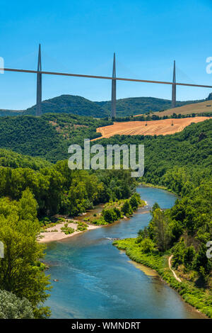 The river Tarn seen from the medieval village of Peyre the Millau viaduct, the worlds tallest bridge in the background, designed by Norman Foster. Stock Photo