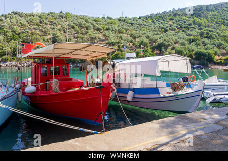 Fishing boats in the picturesque little harbor of Steni Vala village, Alonnisos island, Greece Stock Photo