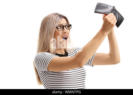 Stressed woman looking at her empty wallet isolated on white background Stock Photo