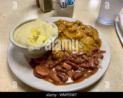 Crawfish Etouffee, Red Beans & Rice, and Grits on a plate, traditional new Orleans food. Stock Photo