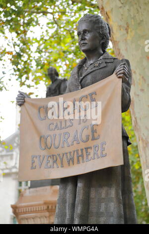 Bronze statue of suffragist leader Millicent Fawcett by artist Gillian Wearing located in Parliament Square, London, UK Stock Photo