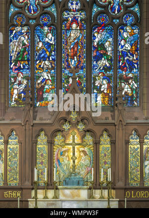 Stained glass windows above the altar of the historic St. Paul's Episcopal Cathedral on Pearl Street in Buffalo, New York Stock Photo