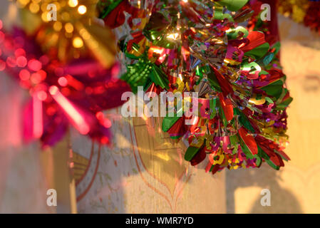 Colorful Sukkah decoration shiny garland at sunset light. Stock Photo