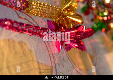 Colorful Sukkah decoration shiny garland at sunset light. Stock Photo