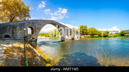 The Bridge of Arta is an old arched stone bridge that crosses the Arachthos river in the west of the city of Arta in Greece. Stock Photo