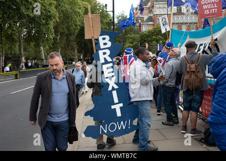 Pro Brexit Leave campaign protesters with messages that We Voted Leave and General Election Now in Westminster on the day after Parliament voted to take control of Parliamentary proceedings and prior to a vote on a bill to prevent the UK leaving the EU without a deal at the end of October, on 5th September 2019 in London, England, United Kingdom. Yesterday Prime Minister Boris Johnson faced a showdown after he threatened rebel Conservative MPs who vote against him with deselection, and vowed to aim for a snap general election if MPs succeed in a bid to take control of parliamentary proceedings Stock Photo