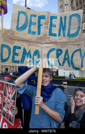 Anti Brexit protesters with messages to Stop Brexit, Stop the Coup and Pro Democracy in Westminster on the day after Parliament voted to take control of Parliamentary proceedings and prior to a vote on a bill to prevent the UK leaving the EU without a deal at the end of October, on 4th September 2019 in London, England, United Kingdom. Yesterday Prime Minister Boris Johnson faced a showdown after he threatened rebel Conservative MPs who vote against him with deselection, and vowed to aim for a snap general election if MPs succeed in a bid to take control of parliamentary proceedings to allow t Stock Photo