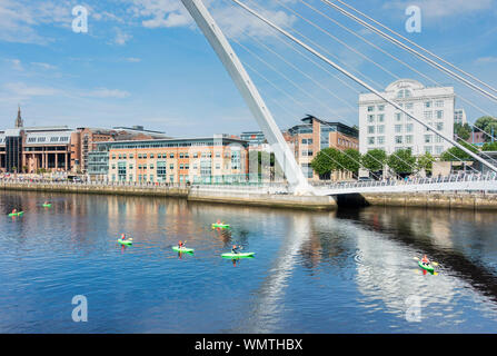 View over river Tyne and Millennium bridge towards Newcastle Quayside from Gateshead Quays. UK. White building is Malmaison hotel.
