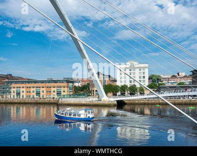 View over river Tyne and Millennium bridge towards Newcastle Quayside from Gateshead Quays. UK. White building is Malmaison hotel.