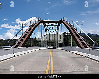 Steel arch suspension road and pedestrian bridge over the Caldera River in Boquete, Panama Highlands. Stock Photo