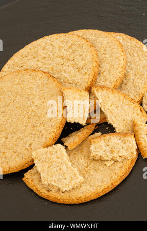 Five Scottish Thin Oat Cakes on a Black Slated Tray Stock Photo