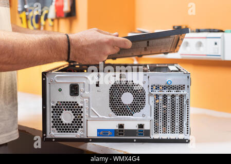 Technician repairing the computer. Concept of computer hardware, repairing, upgrade and technology . Stock Photo