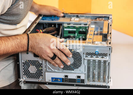 Technician repairing the computer. Concept of computer hardware, repairing, upgrade and technology . Stock Photo