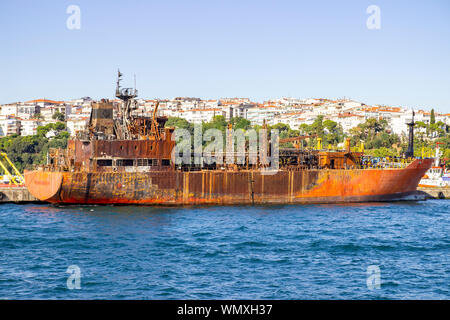 Old rusty oil tanker ship abandoned in a port in Istanbul. Ready to be repaired or demolished Stock Photo