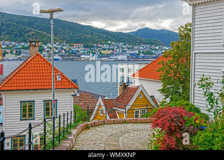 Timber houses in the neighbourhood of Nordnes and the shipping port facilities of Bergen, Norway. Stock Photo