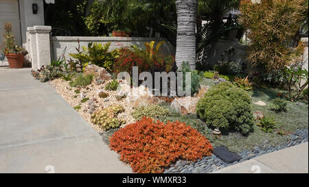 Medium close up of beautifully done drought-tolerant landscaping in a front yard in California Stock Photo