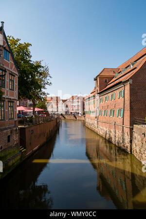 Stade, Germany - August 25, 2019: View at Schwinge River and old historical town of Stade.  Swedish Warehouse Museum at the right. Stock Photo