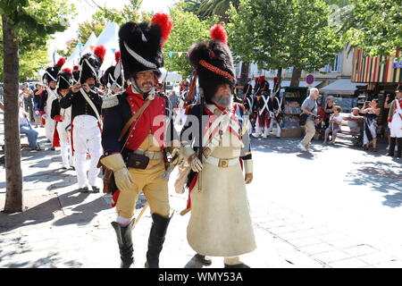 The reenactors dressed as Napoleon epoch soldiers for celebration the Napoleon birthday who was born in Ajaccio 250 years ago. Stock Photo