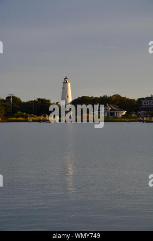 The historic Ocracoke Light Station from across the Silver Lake harbor. Stock Photo